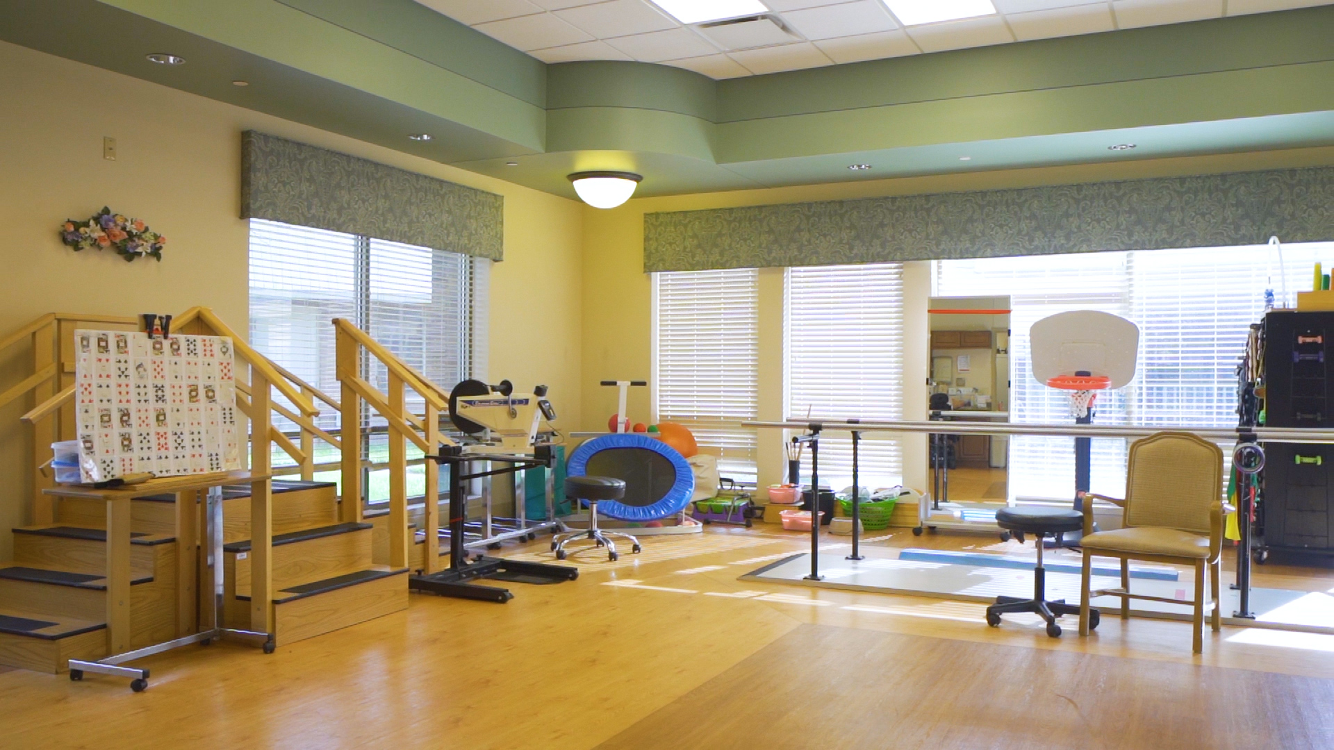 Wooden ladder, parallel bar and other therapy equipment inside the Gym.